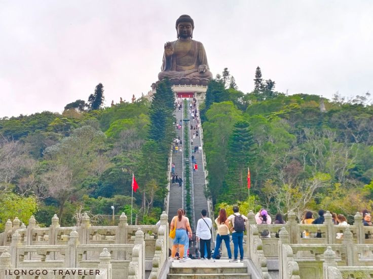 Tian Tan Buddha statue at Ngong Ping, Lantau Island, Hong Kong with mountain backdrop