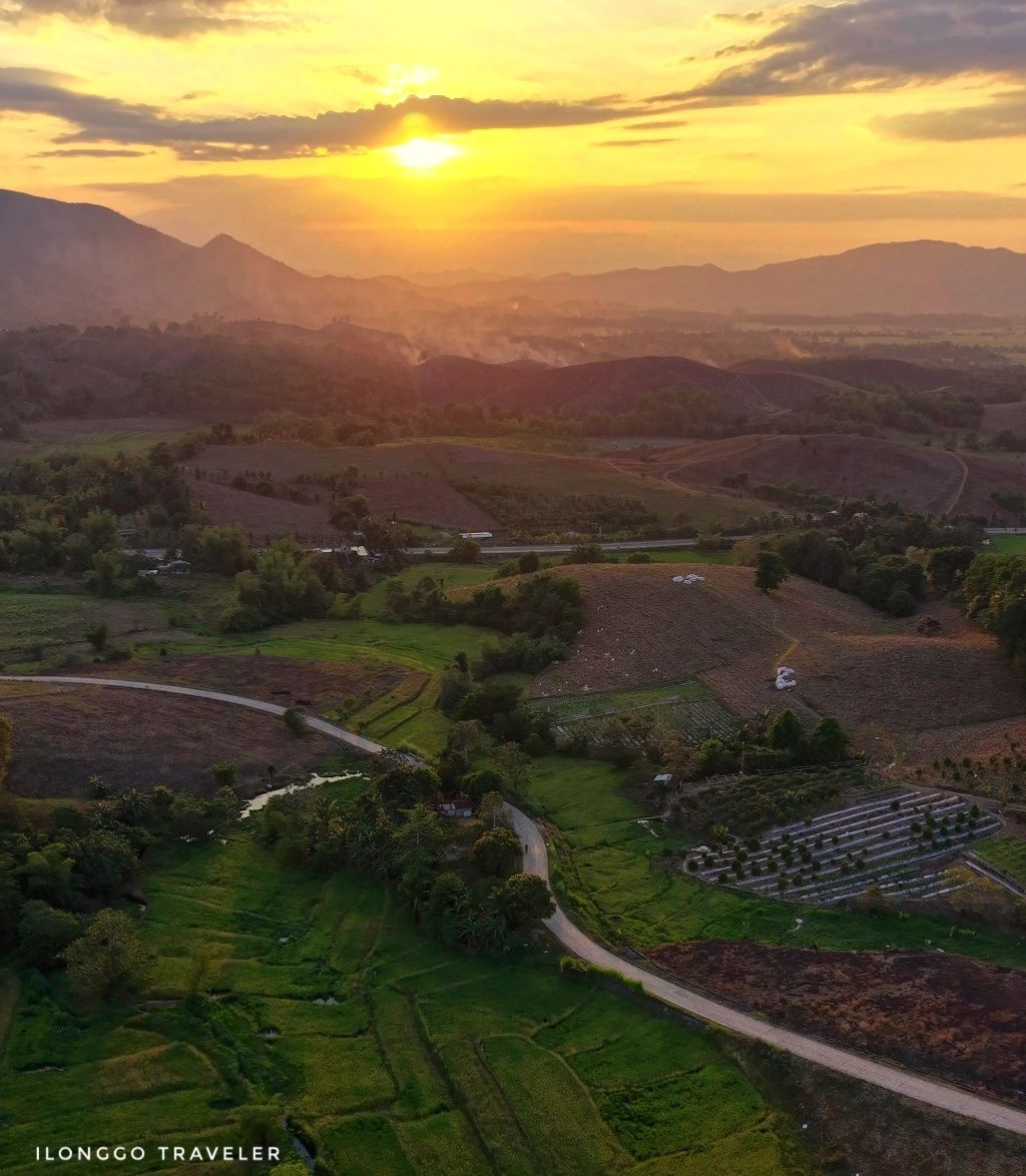 Sunset road in San Rafael Iloilo Scenic road during sunset in San Rafael Iloilo with golden sky and hills